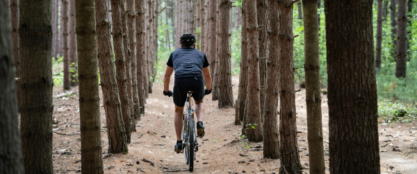 Man riding a mountain bike through the woods